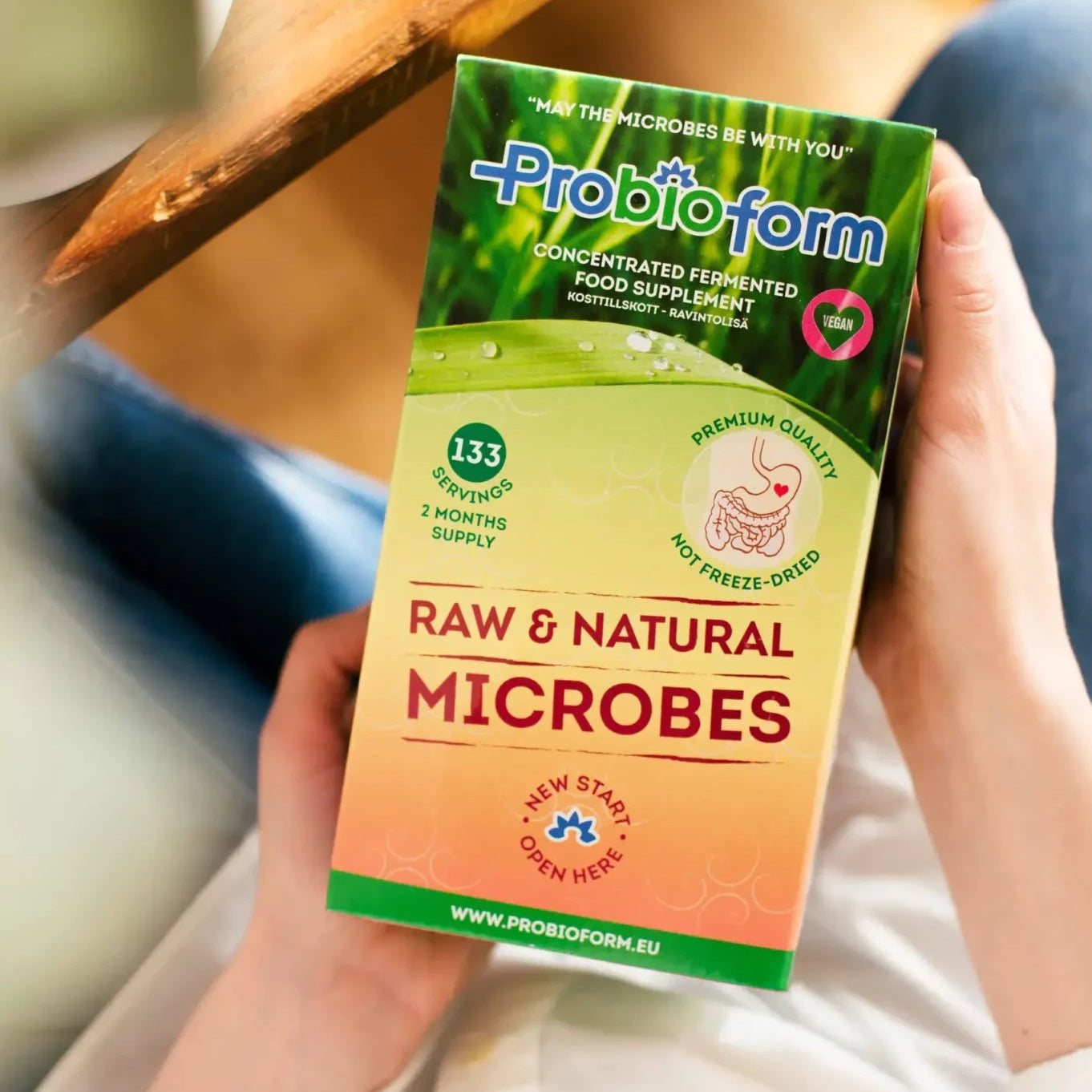 Probioform Raw & Natural Microbes packaging held by a person